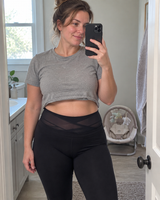 Mother a few months postpartum wearing the support brief under leggings